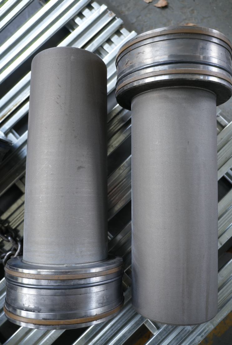 Laser cladding machine has processing drive rollers.png